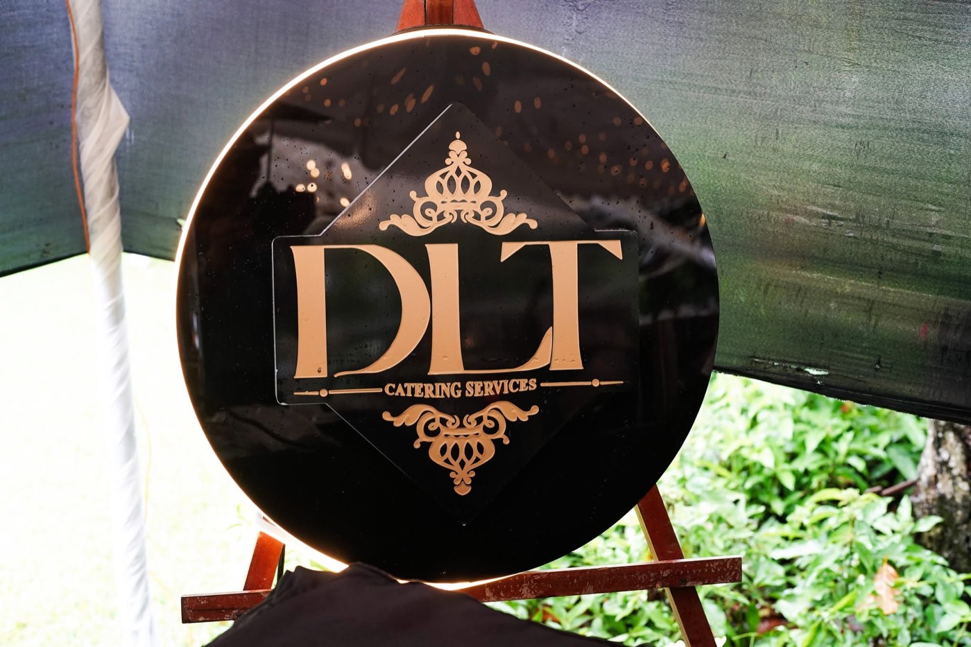Real engraved DLT Catering Services event signage