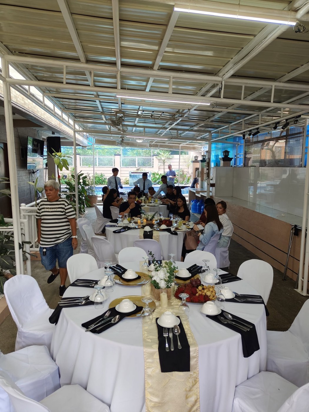 A real DLT Catering Services reception, poolside venue with seated guests